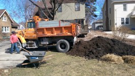 First, Dennis unloads the compost. It smells wonderful!